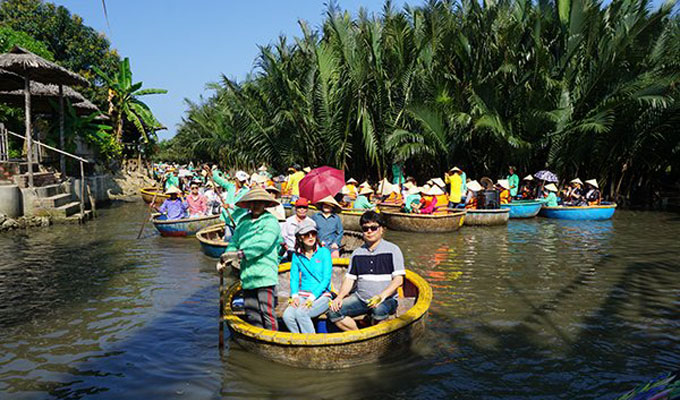 Experiencing basket-boat tour on Bay Mau coconut forest